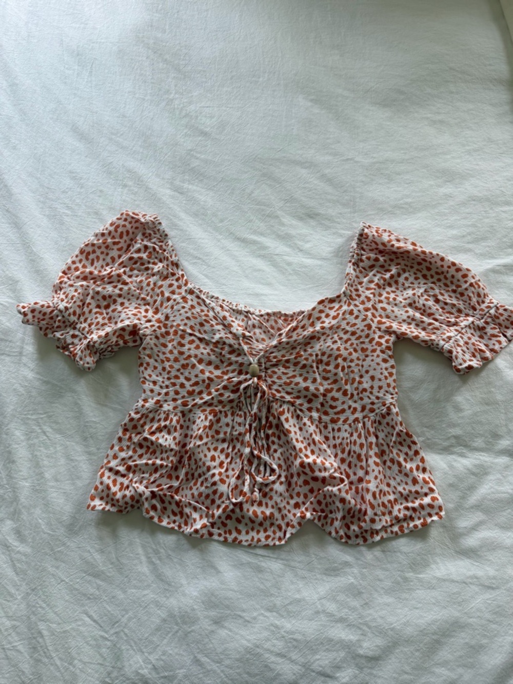 Women's Rust Spot Print Tie-Front Peplum Top